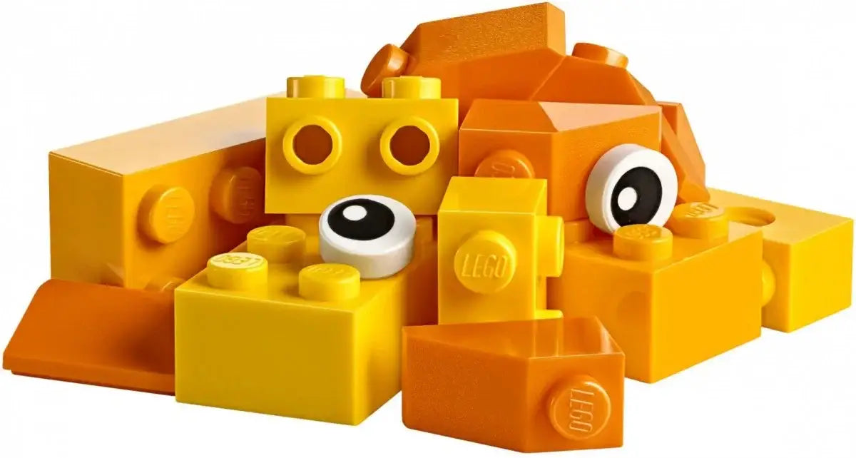 Żółte i pomarańczowe klocki LEGO dla dzieci, kreatywne zabawki rozwijające wyobraźnię.