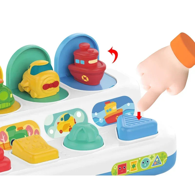 Kolorowa zabawka z przyciskami i pojazdami wyskakującymi WOOPIE BABY - zabawki-dla-dziewczynki